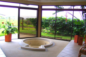 The two single-story houses have jacuzzis between the view windows and the living room.